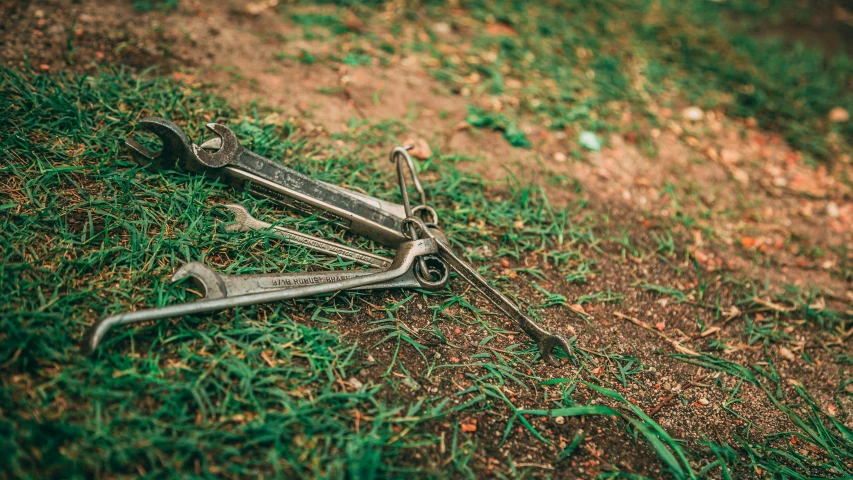 an old pair of scissors is laying on the ground