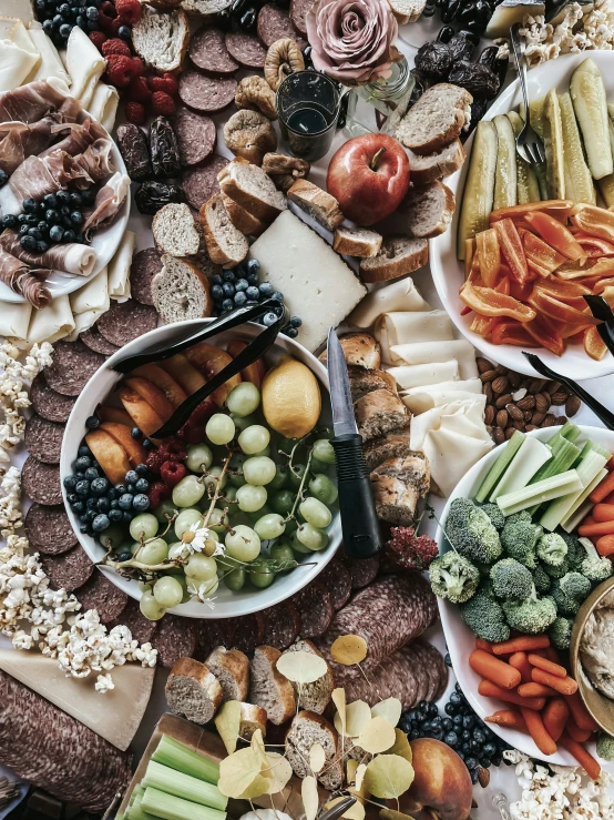 a bunch of plates of food on a table