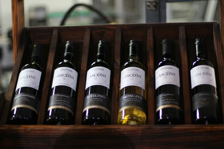 six bottles of wine in a wooden box