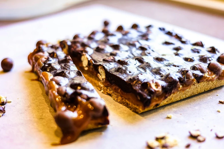 chocolate and almond bars laying on the counter