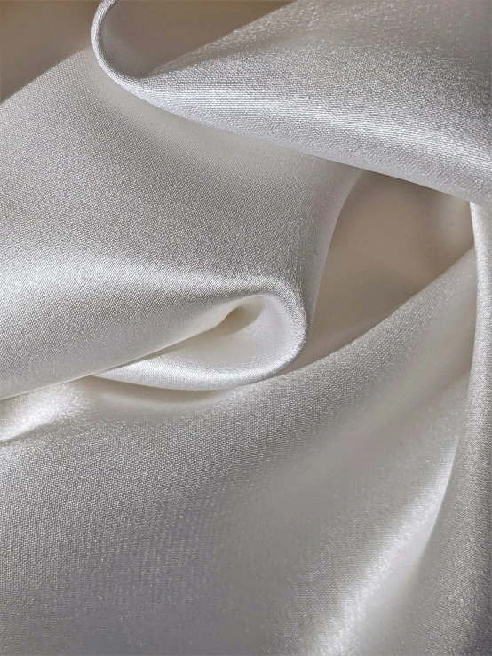 the textured fabric is soft and white