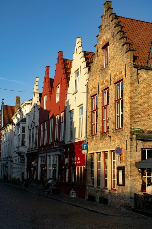 rows of buildings are next to each other on a street