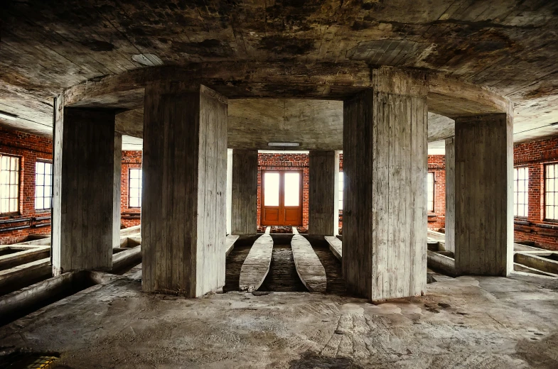 a bunch of pillars sitting inside of a building