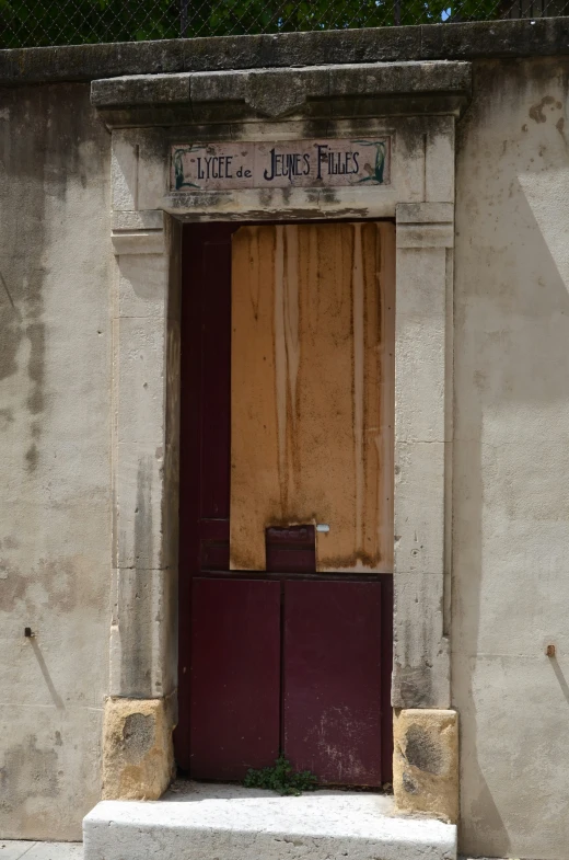 a wall that has a door on it and a window