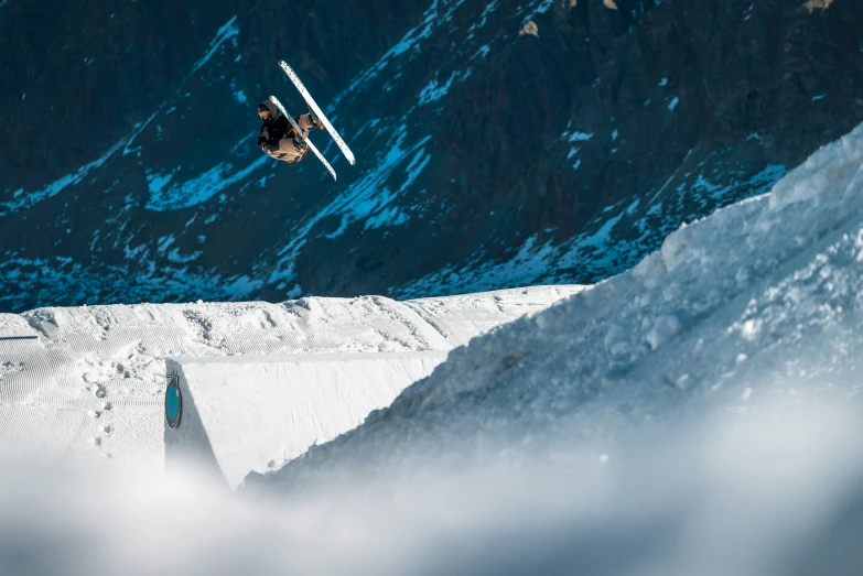 a man flying through the air while riding skis