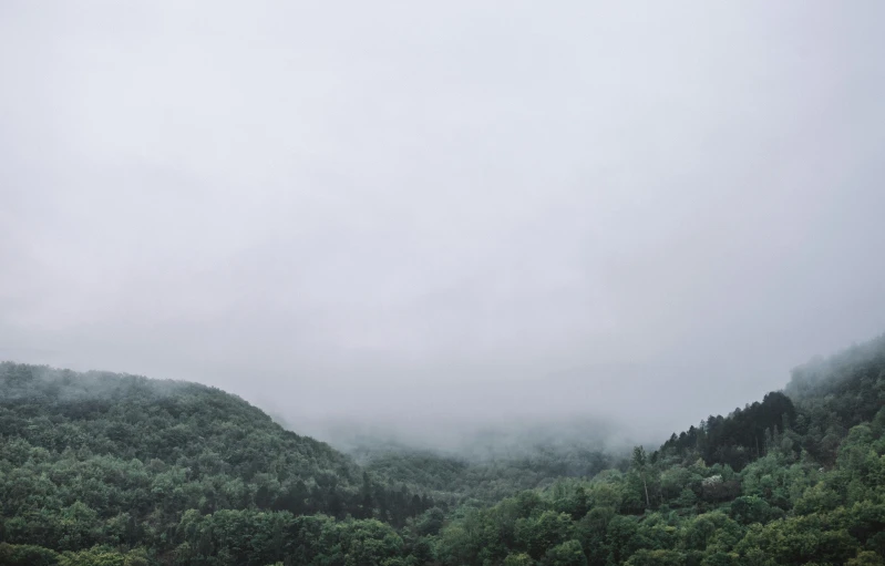 the sky is filled with fog and rain