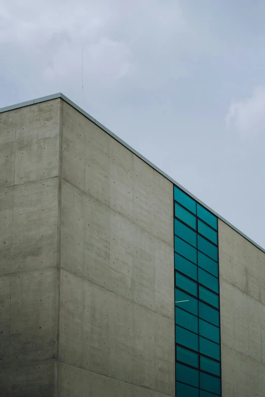 an airplane flies by a building in the sky