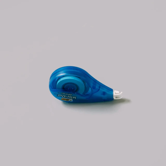 a blue toothbrush on a white table