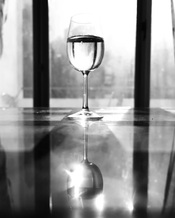 a close up of a wine glass on the table