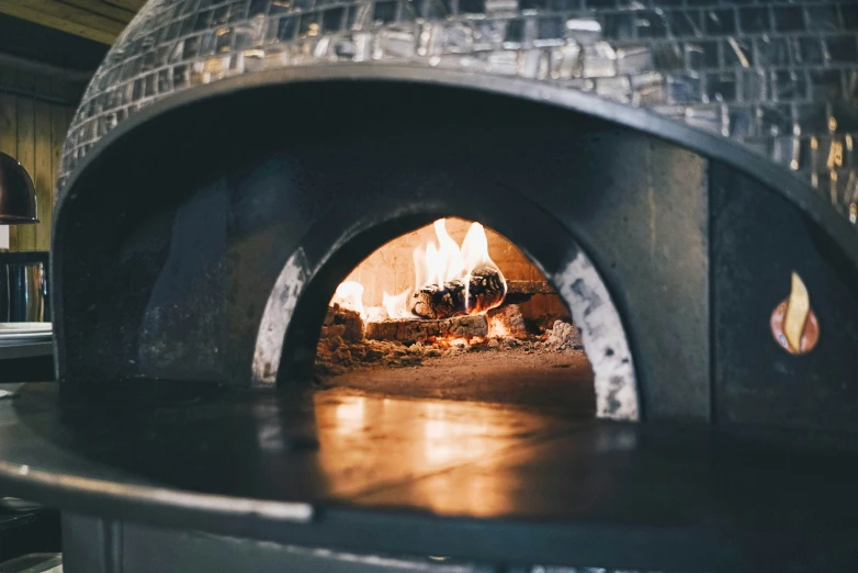 an oven sitting in a kitchen with fire