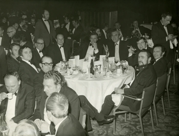 an old po of a formal gathering of men at table