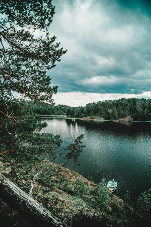 a boat floating in the middle of a river