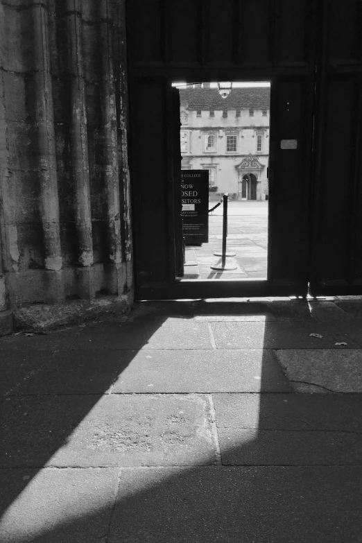 a door with two open doors is visible in this black and white image