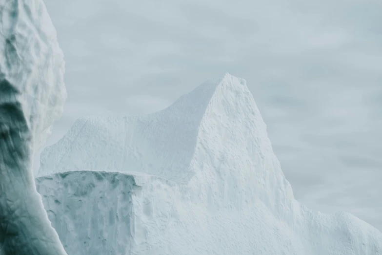 a blue po of a mountain with ice formations