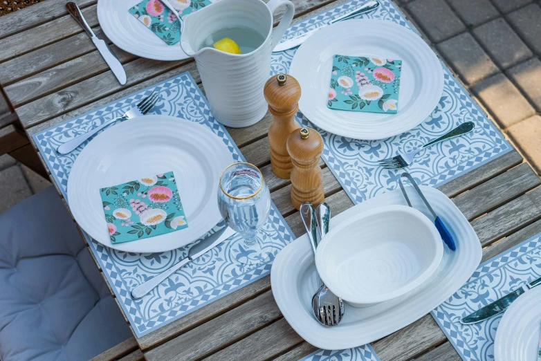 a table set with four place settings for two people