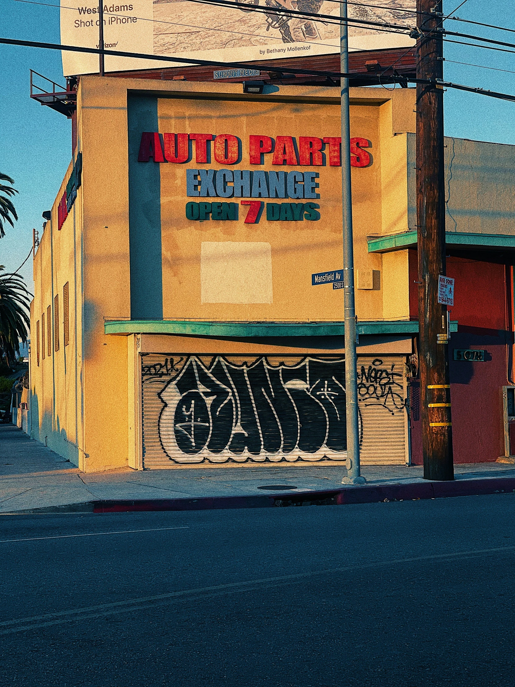 an old commercial building with graffiti on it