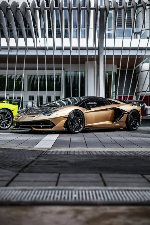 a car and a small yellow car are parked together