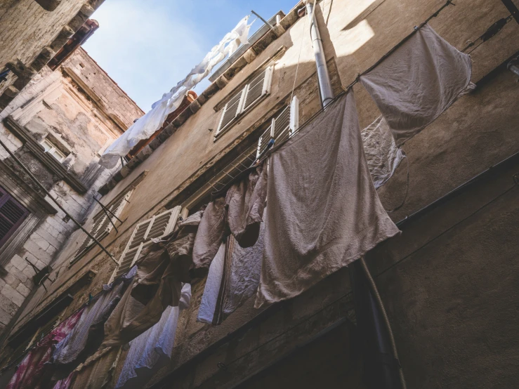 clothes hanging in a line outside on clothes lines outside