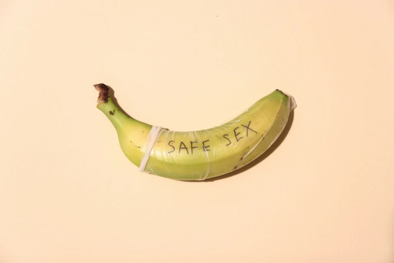 there is a banana with tape on it and says safe sex