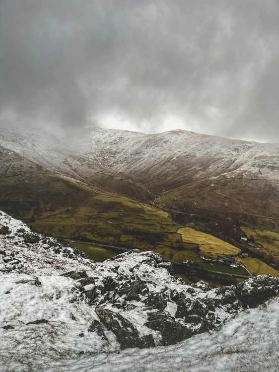 a hill covered in lots of snow and grass