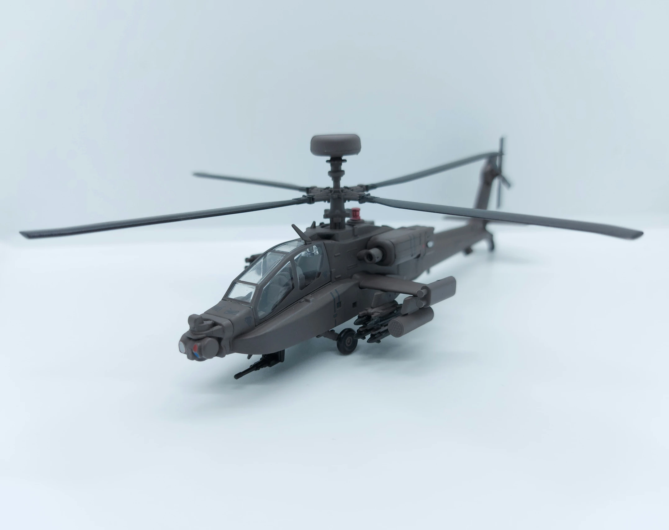 a toy helicopter is on a white background