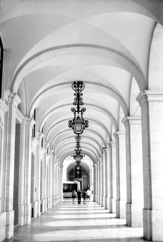 black and white po of an archway lined with pillars