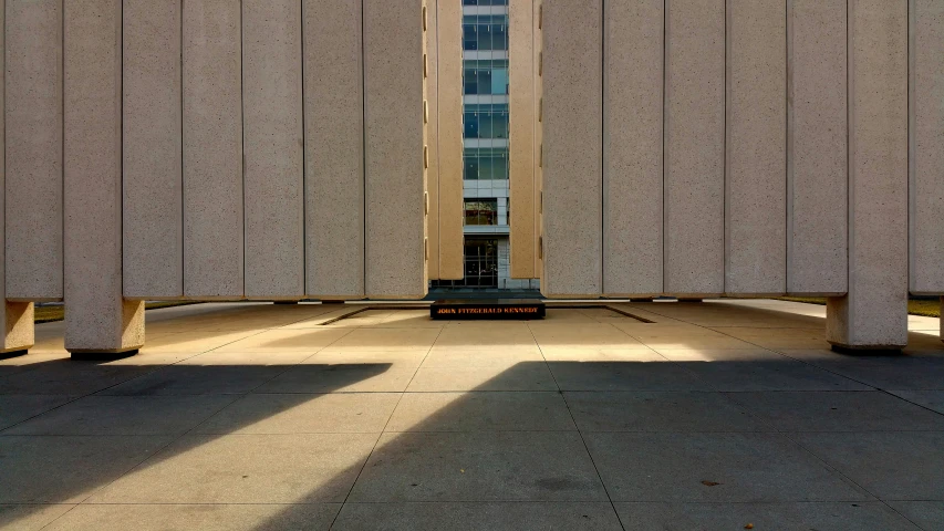 an abstract sculpture is seen in the center of a concrete surface