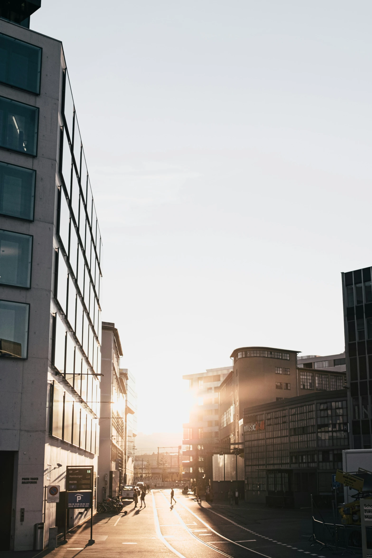 a sunny street in the middle of the city