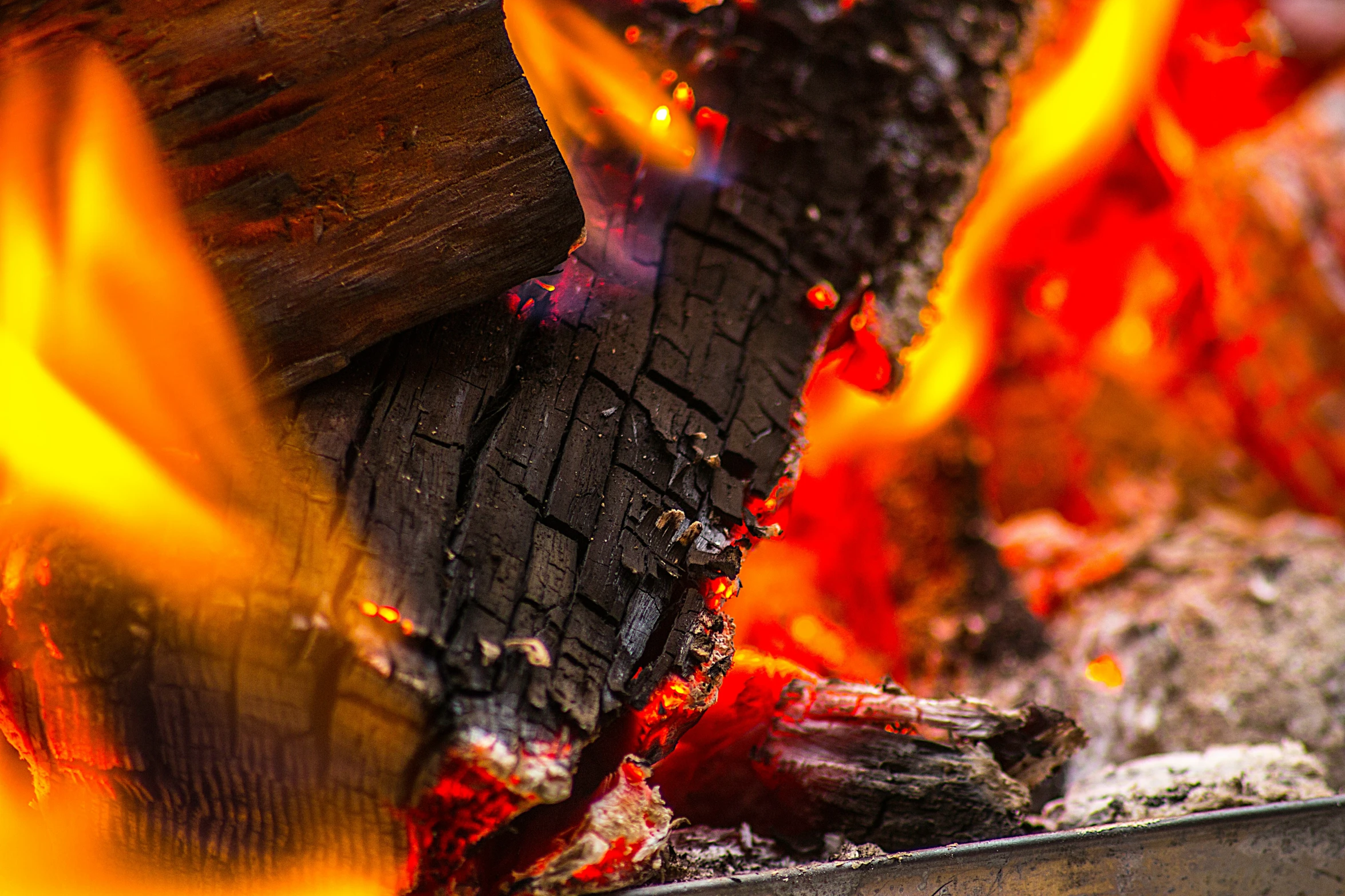 wood is being cooked in front of a fire