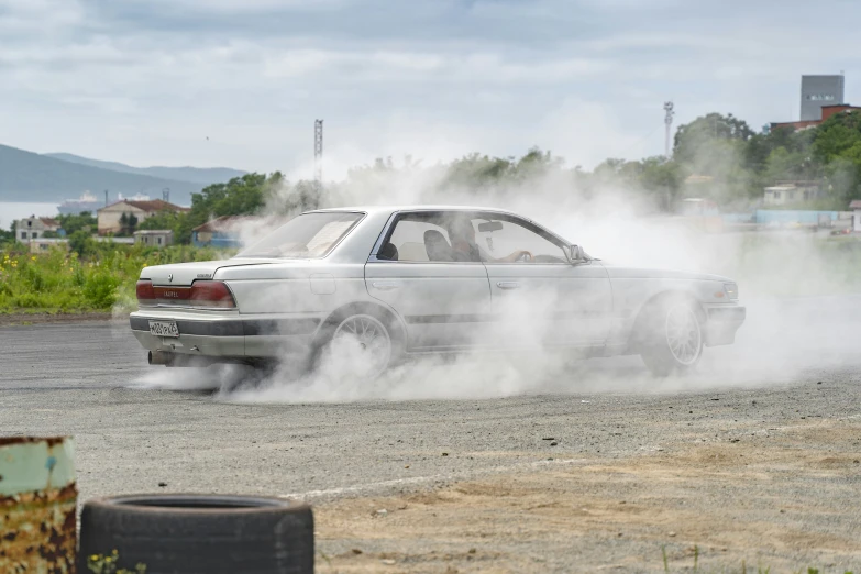 an old bmw with lots of dust and some wheels