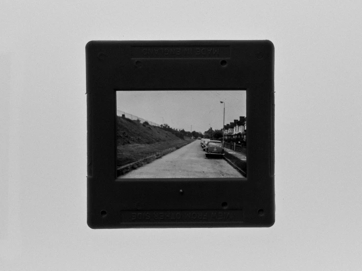 a black - and - white pograph of cars on a road