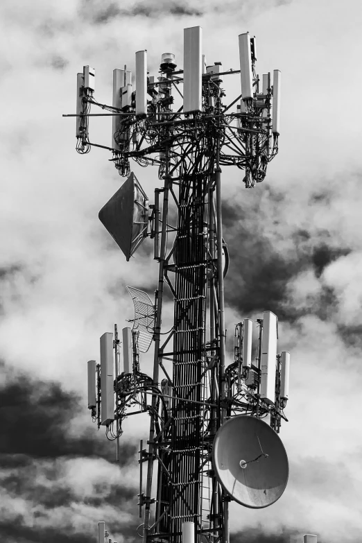 a tall metal tower with several antennas on top