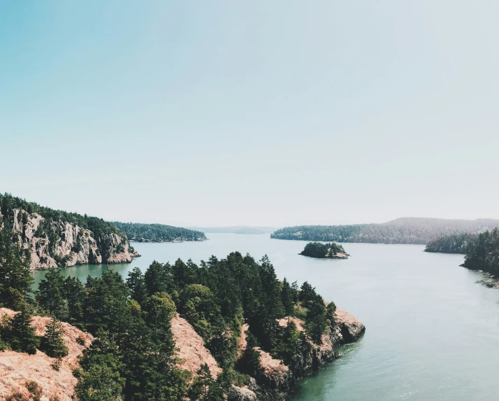 an overlook point shows water, trees and rocky shoreline