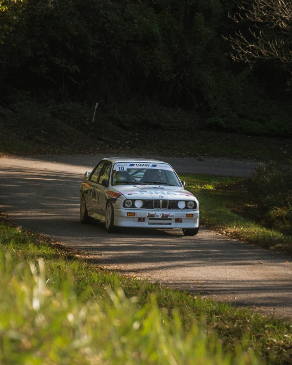 a bmw in a race going around the bend