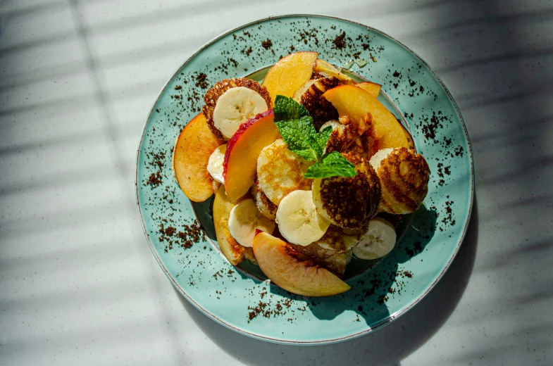 fresh fruit and chocolate chips sit on top of a plate