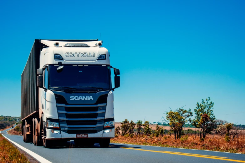 a big rig truck driving down the road