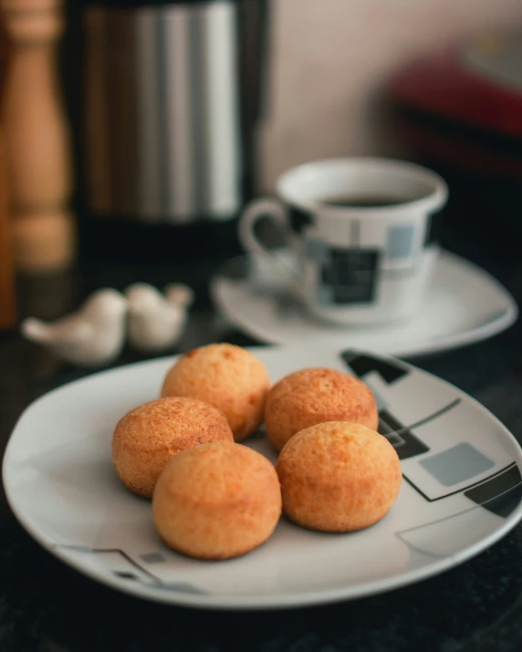 plate full of a number of tiny donuts