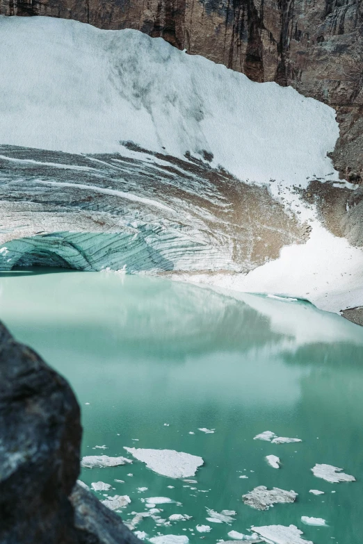 a mountain scene with a glacier and ice