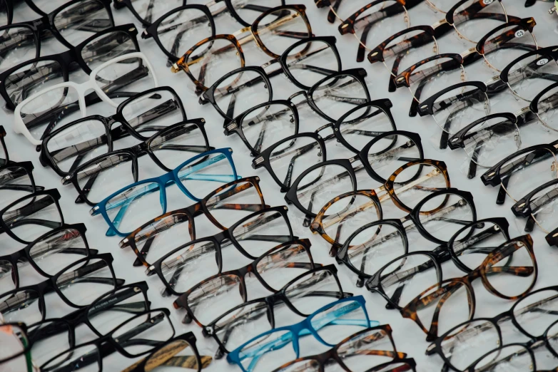 rows of glasses lined up on display for sale