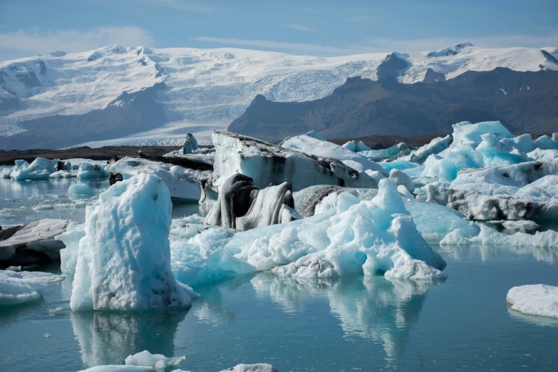 large blue pieces of ice in a frozen lake