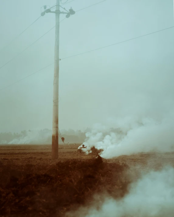 steam is pouring into the ground while onlookers are out