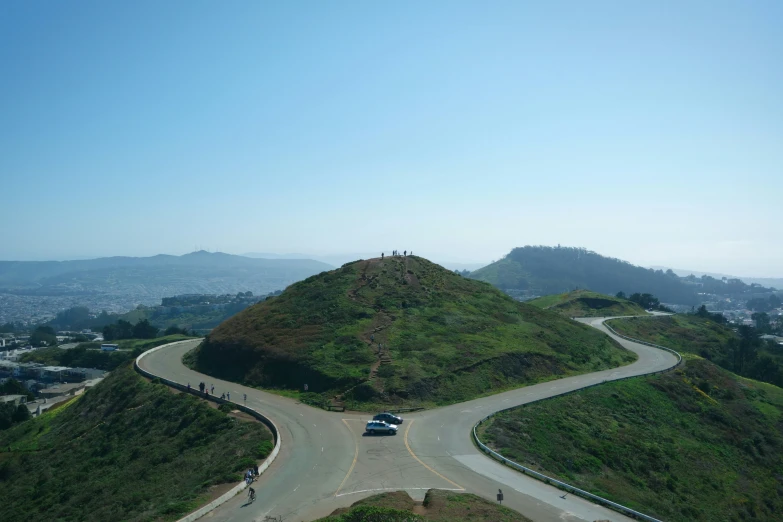 a view of a highway going through the center of a hill