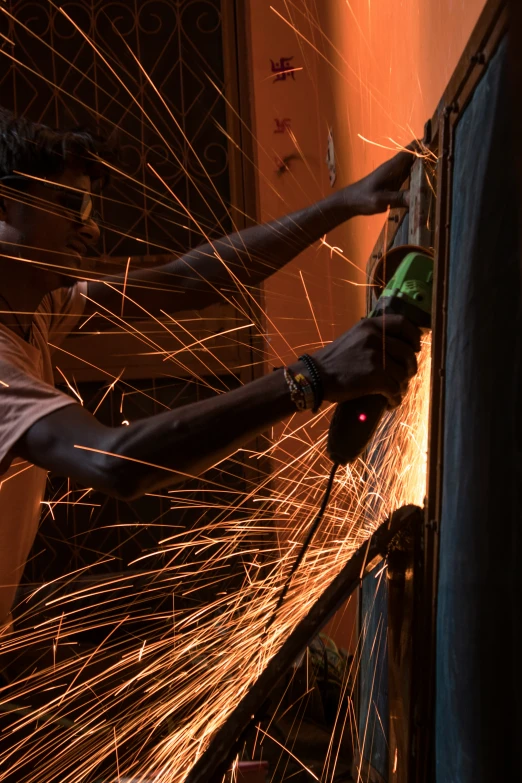 welders working on the inside of an old building