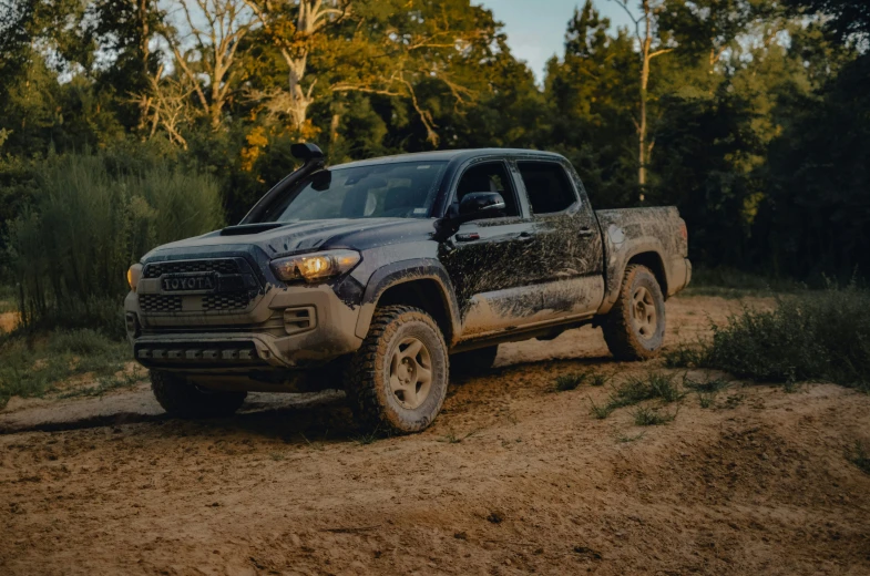 a pickup truck parked in a dirt area