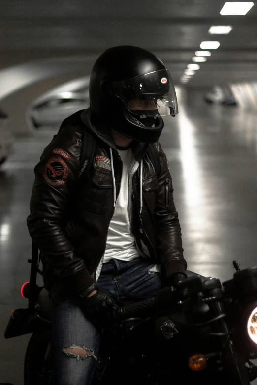 a person on a motorcycle riding through a tunnel