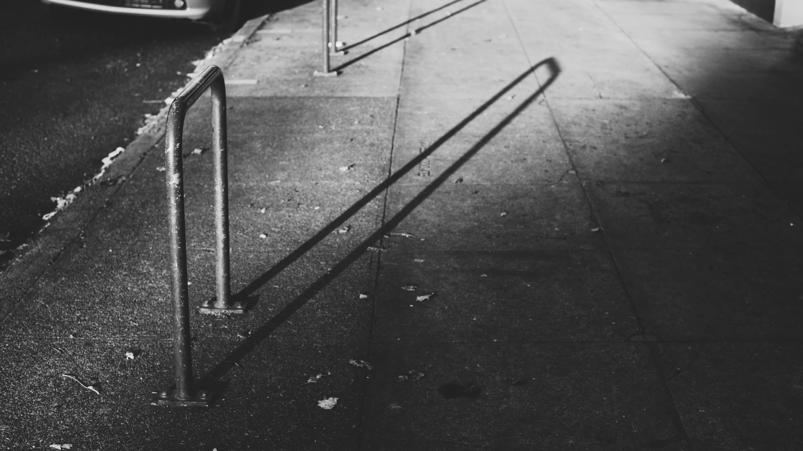 a person walking down the street next to a ramp