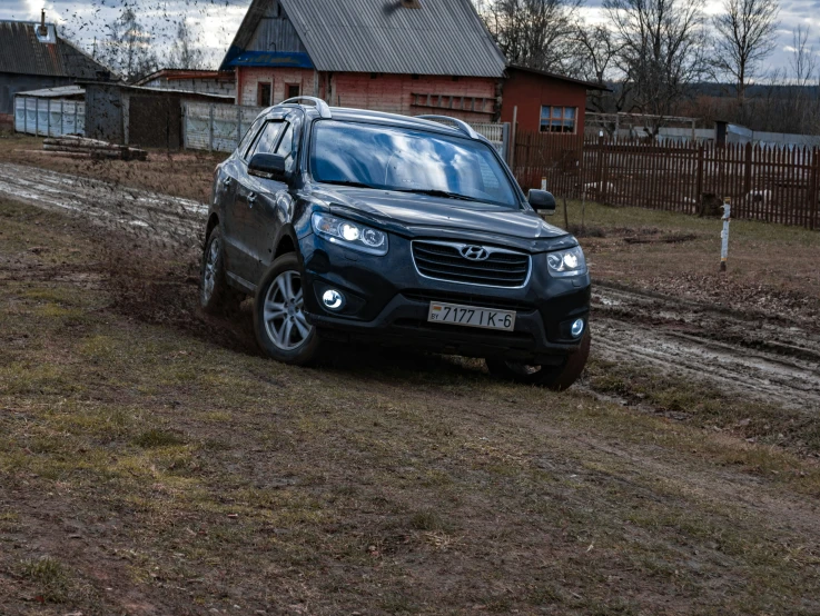 a blue suv parked on the side of a road