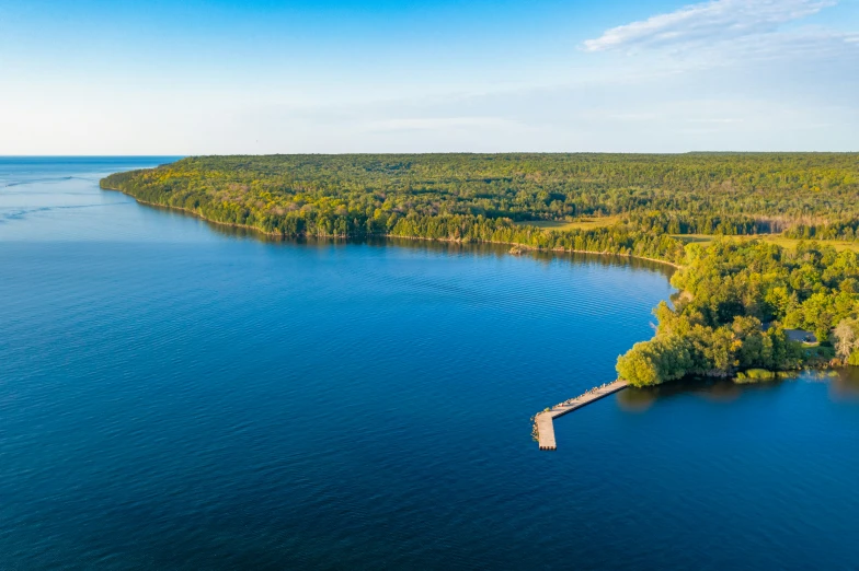 an aerial view of an island and lake