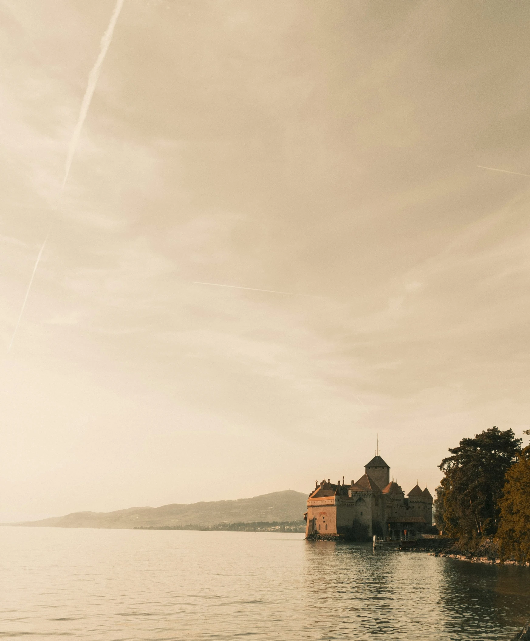 the lake view of an island with a church in it