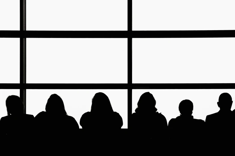 a black and white po of a window with lots of people sitting